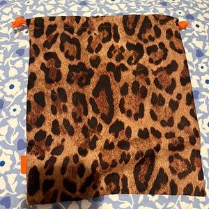 A cute cheetah print jawstring mini bag perfect for a bag to bring accessories